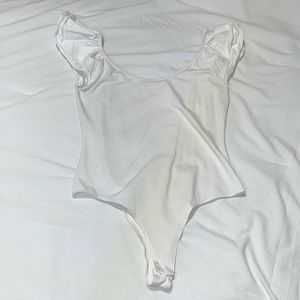 white off-the-shoulder ruffle sleeve body suit